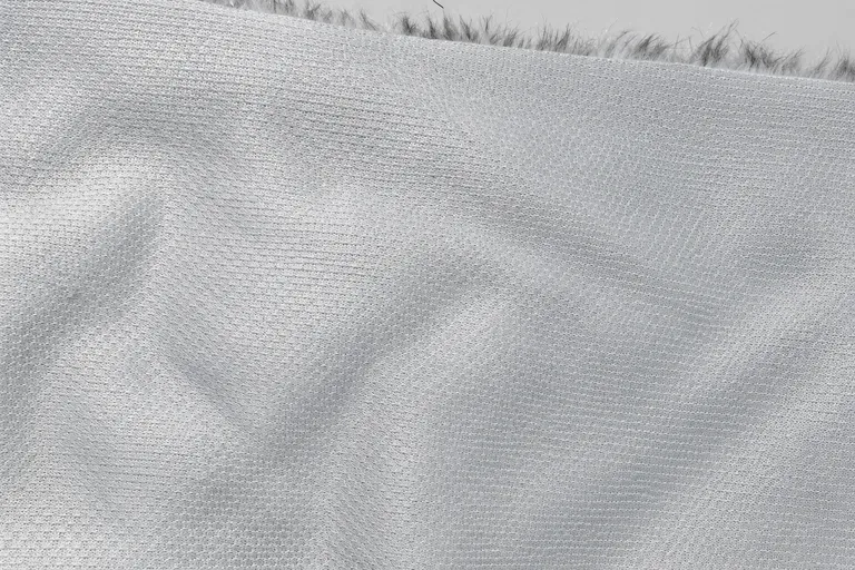 2-Tone Printed Spotted Fox Faux Fur Fabric - knitted backing