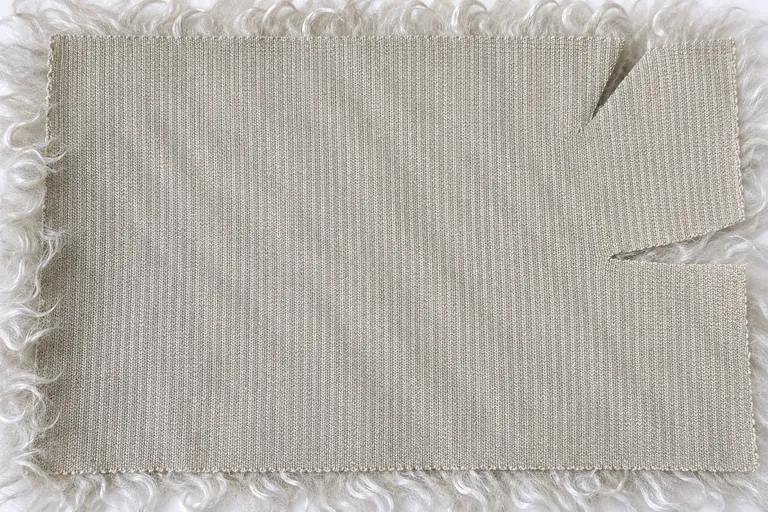 Ivory Curly Lamb Faux Fur Fabric - knitted backing
