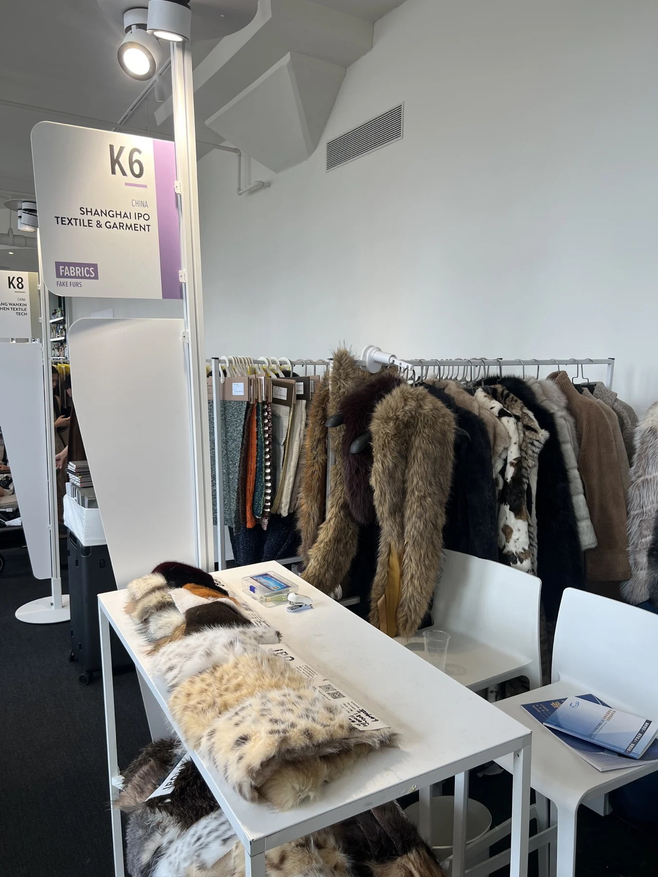 Hanging swatches and table display at the Shanghai IPO exhibition stand