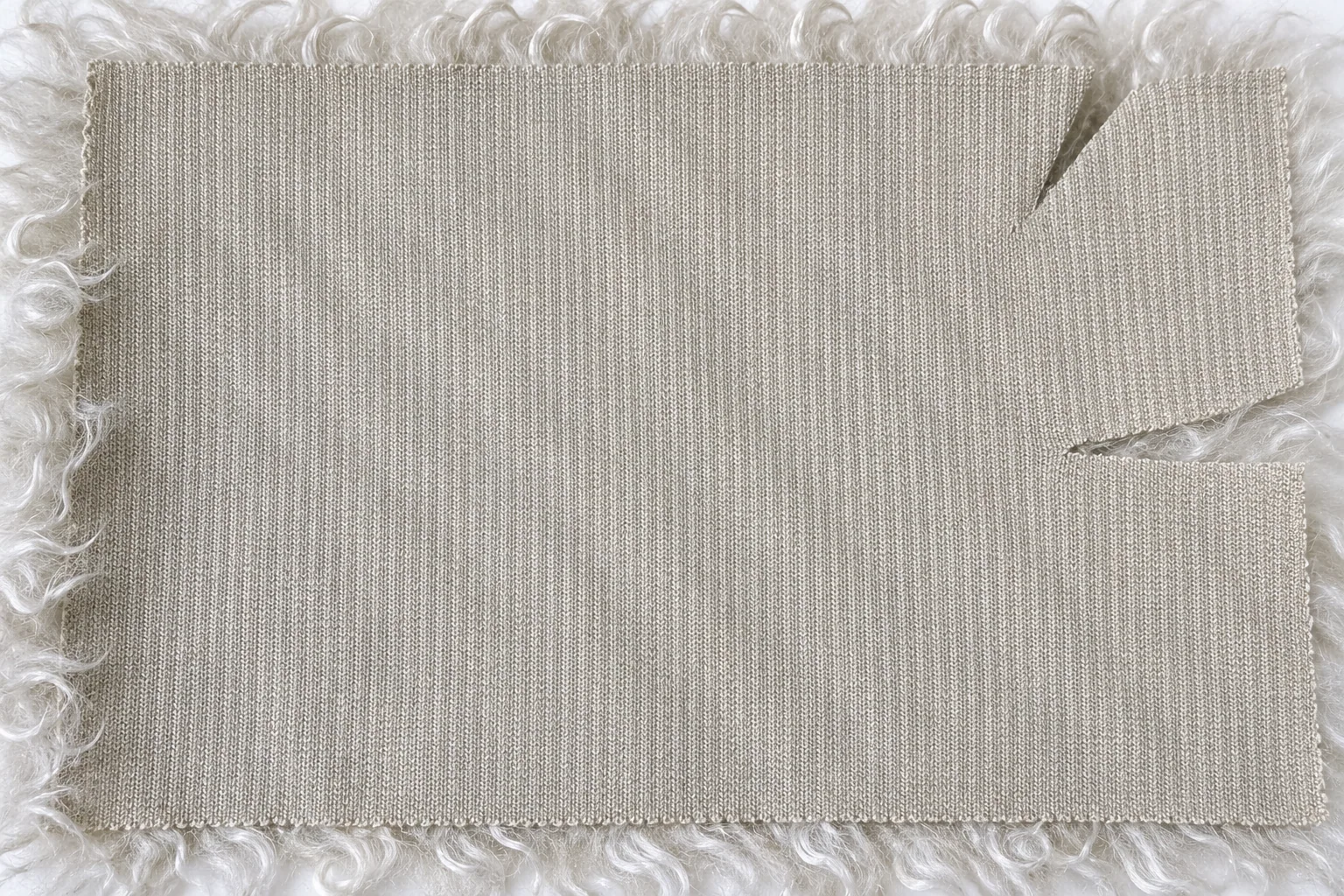 Ivory Curly Lamb Faux Fur Fabric - knitted backing